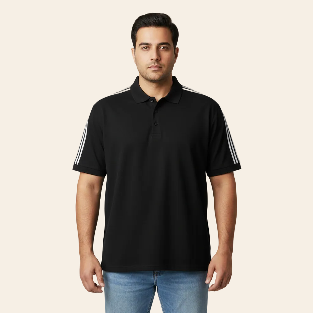 Man wearing a black polo shirt with white stripes on a gray background