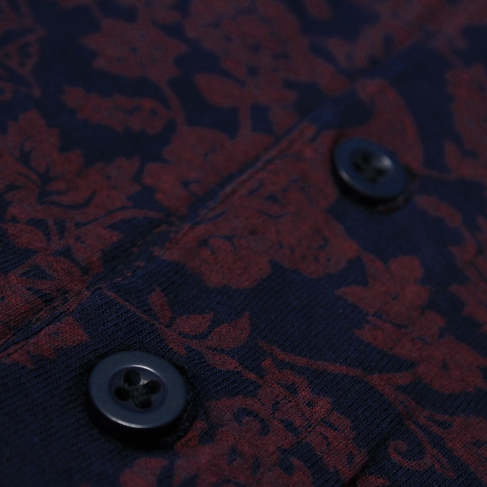 Navy floral print polo shirt made from soft cotton jersey fabric with short sleeves and three button placket by Bigwear.pk