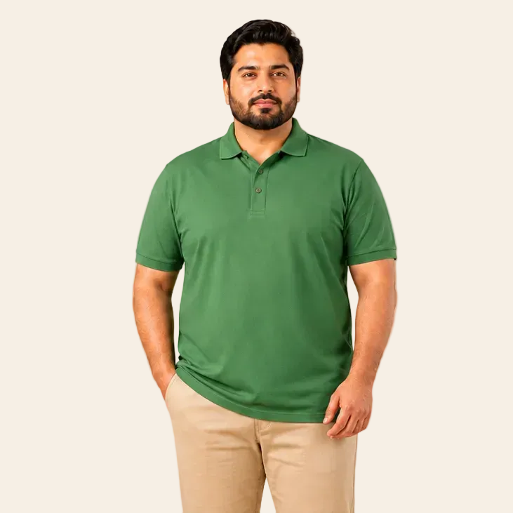 Man wearing a green polo shirt and beige pants on a beige background