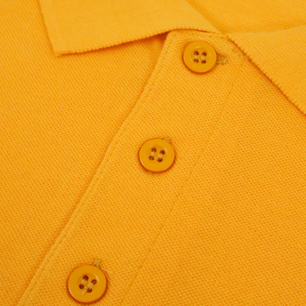 Sunset orange plain polo shirt with ribbed collar and three button placket in cotton blend